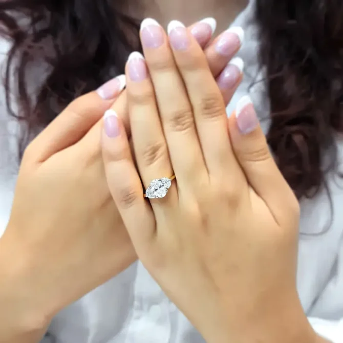 Oval and half moon lab grown diamond engagement ring on hand-tr1095-4