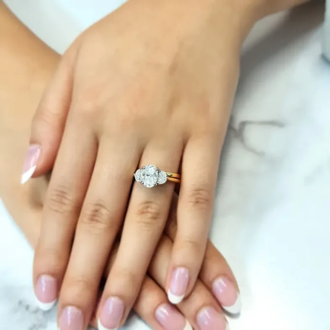Oval and half moon lab grown diamond ring on hand-tr1095-3