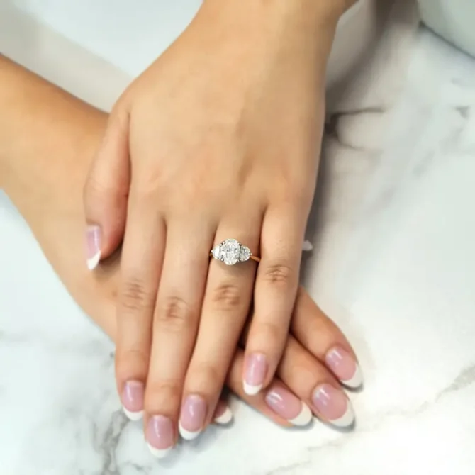 Oval and half moon lab grown diamond ring on hand-tr1095-6