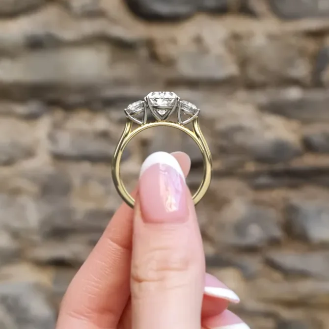 Oval three stone diamond engagement ring in yellow gold tr1085 look through view on hand