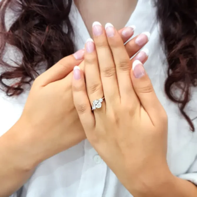 Oval three stone diamond ring on hand in white gold-tr1006-4