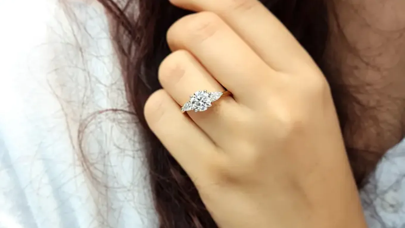 Round and pear cut diamond ring in Dublin on hand-tr1092-2