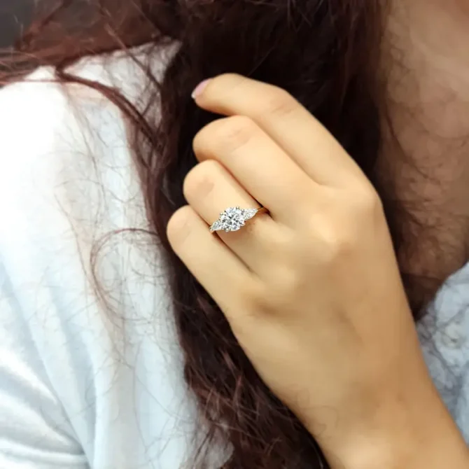 Round and pear cut diamond ring in Dublin on hand-tr1092-2