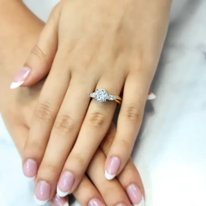 Round and pear cut lab grown diamond engagement ring from Dublin jewellers on hand - tr1094