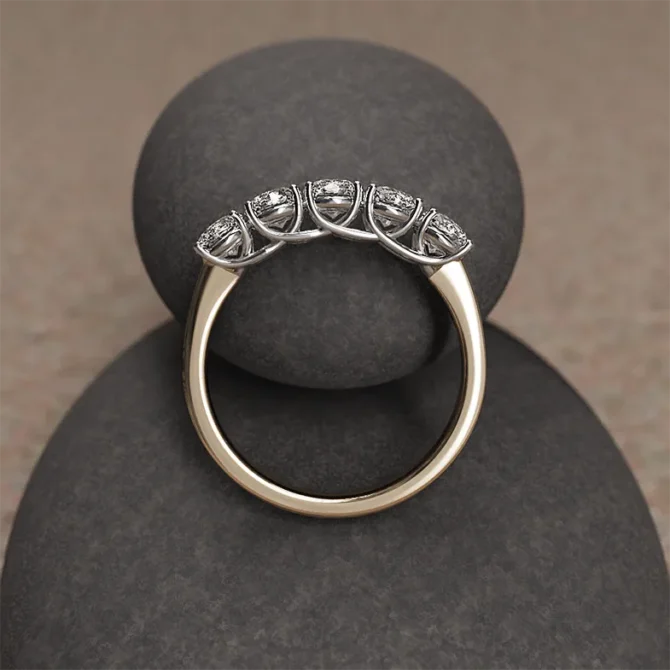 1ct yellow gold five stone ring on rock