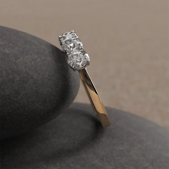 1ct yellow gold five stone ring on rock