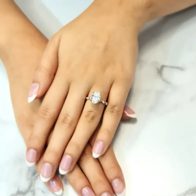 certified lab grown oval shape diamond engagement ring with invisible halo on hand-pr1022-1