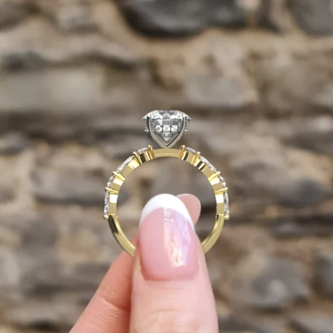 round cut diamond ring with marquise diamonds on band with invisible halo in yellow gold side view pr1044 - Made in Dublin, Ireland