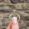 round cut diamond ring with marquise diamonds on band with invisible halo in yellow gold side view pr1044 - Made in Dublin, Ireland