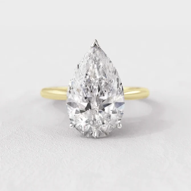 Pear solitaire diamond engagement ring in yellow gold sr1094