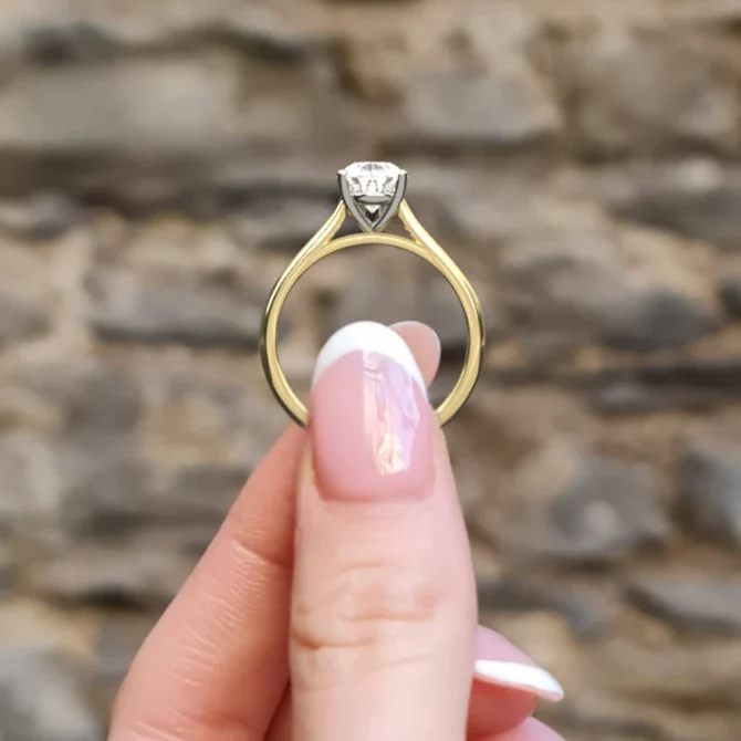 Pear cut solitaire diamond engagement ring sr1094 1.5ct in yellow gold side view in hand