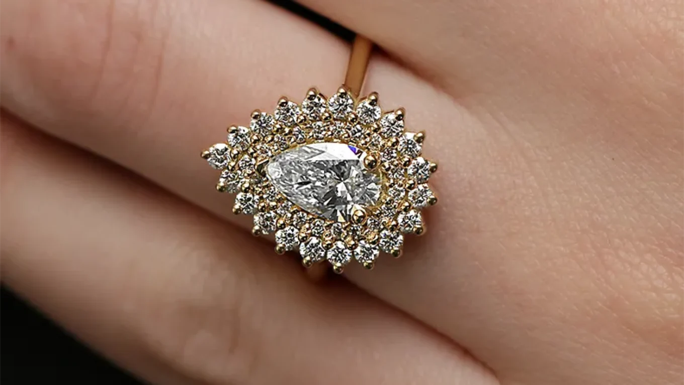 Double halo pear engagement ring in yellow gold on hand vr1108