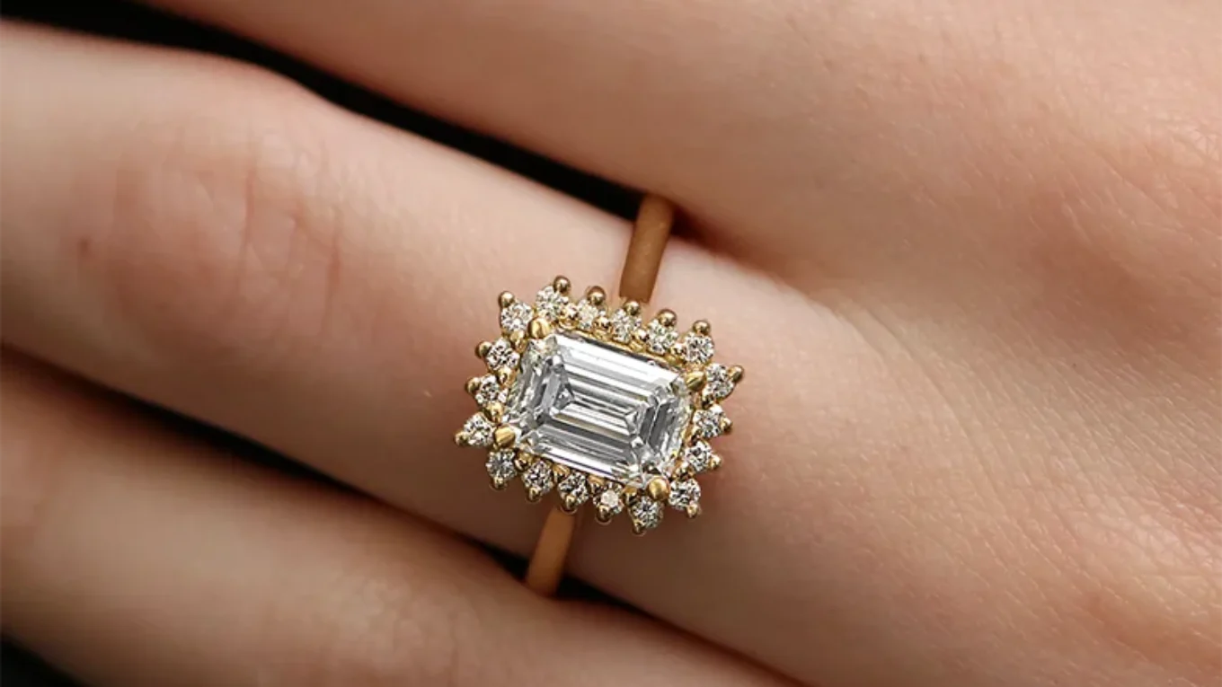 Emerald cut halo diamond engagement ring on hand vr1105