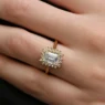 Emerald cut halo diamond engagement ring on hand vr1105