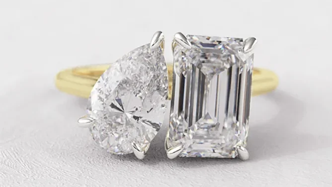 Toi Et Moi engagement ring with pear and emerald cut diamonds in yellow gold.webp