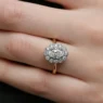 Vintage style oval halo milgrain diamond ring on finger VR1115