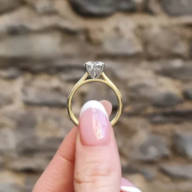 hand image 8mm four claw tulip solitaire ring in yellow gold made in Ireland