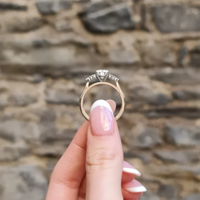 Oval shape diamond engagement ring in vintage style setting PR1070 in rose gold side view in hand