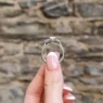 Oval shape diamond engagement ring in vintage style setting PR1070 in white gold side view in hand