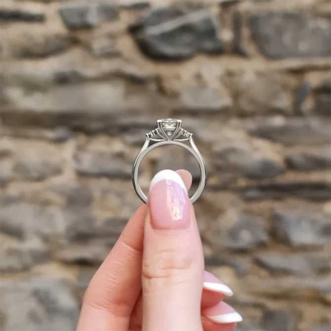 cushion stepping stone engagement ring in white gold pr1078 side view in hand