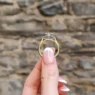 cushion stepping stone engagement ring in yellow gold pr1078 side view in hand