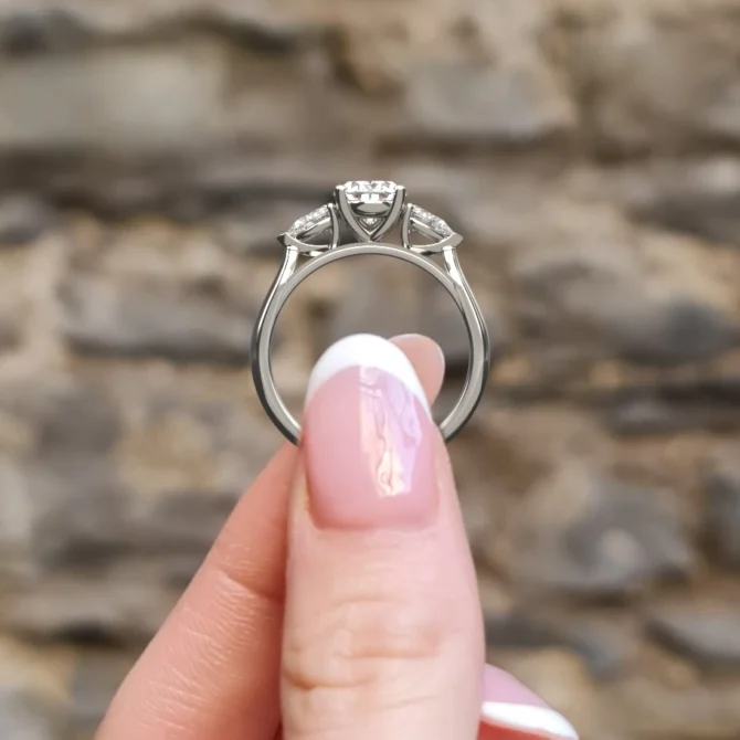 hand holding engagment ring tr1021 white