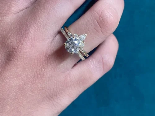 Crown style wedding band with round and pear shape diamonds