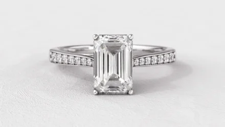 Emerald Side Stone Engagement Rings