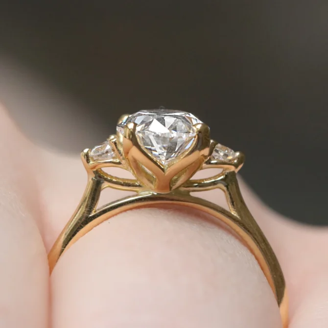 Oval Cut Trilogy Engagement Ring TR1102 on hand side view