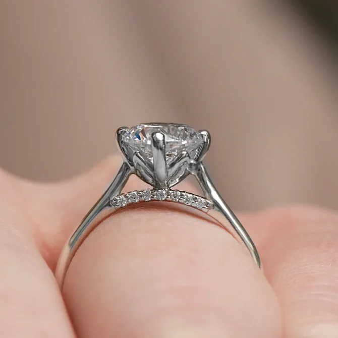 Round Cut Engagement Ring With Diamond Bridge SR1020 on hand side view