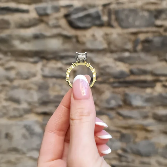 hand holding engagment ring pr1086 yellow gold