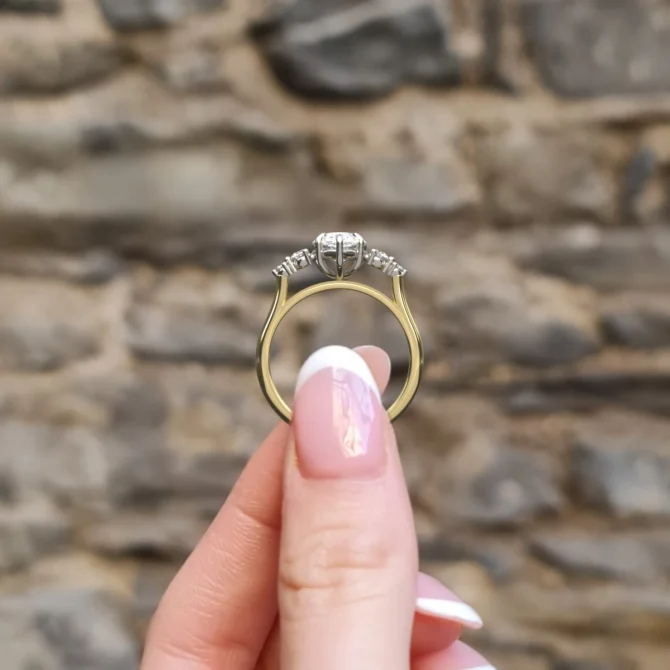 Graduating pear cut diamond side stone ring pr1101 yellow gold - side view